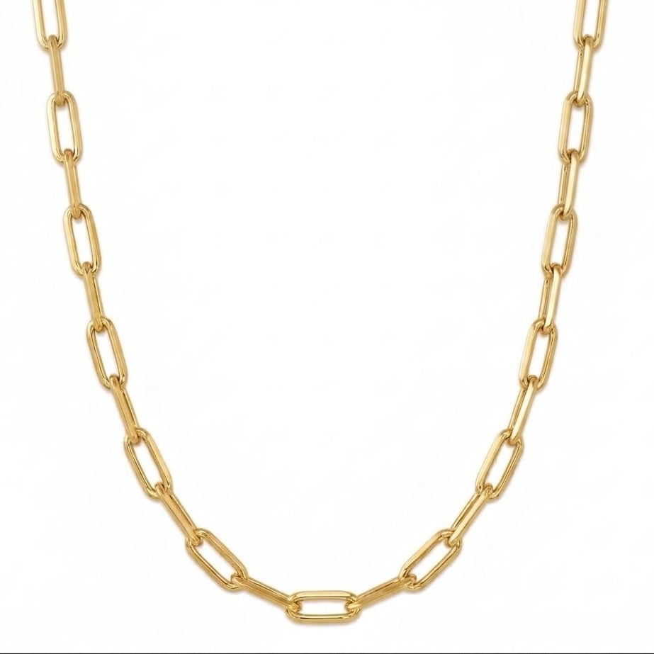 A gold paperclip chain necklace displayed against a solid white background.