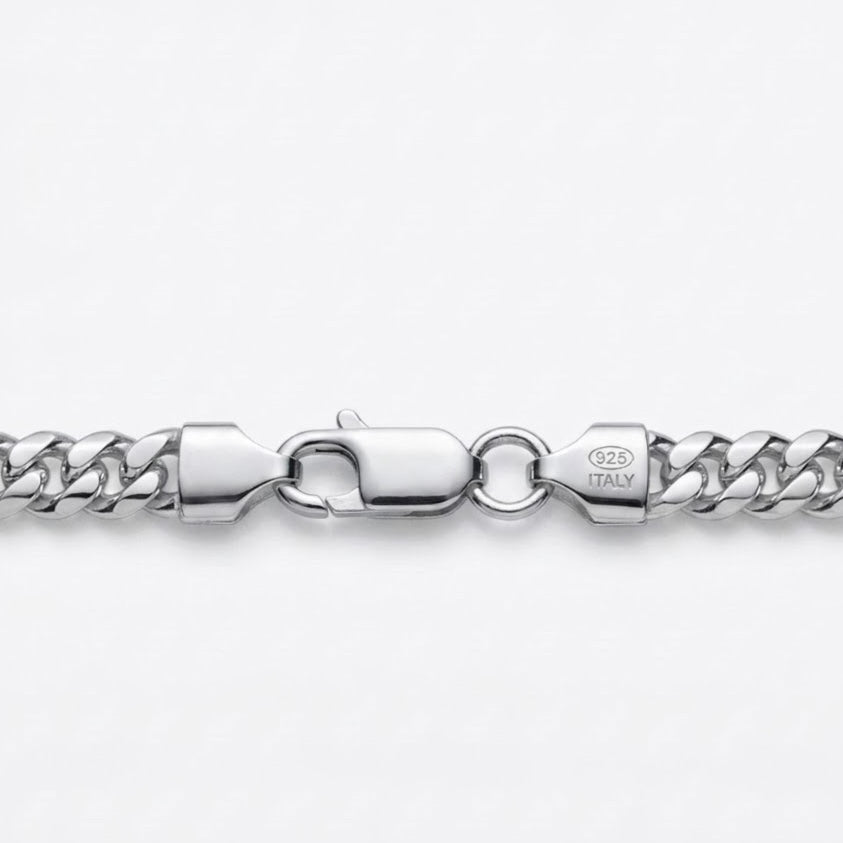Close-up of a silver-toned Cuban link chain bracelet showing the lobster clasp and a stamped '925 ITALY' hallmark on a clean white background.
